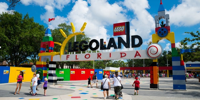 WINTER HAVEN, FL, USA - June 18, 2014: Visitors pass through the entrance to Legoland Florida