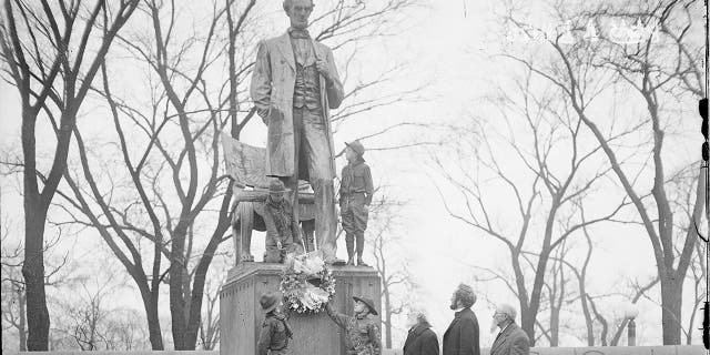 Four Boy Scouts standing at the Lincoln Monument, designed by Augustus Saint Gaudens, in Lincoln Park in Chicago, Ill., in 1929. (Chicago Sun-Times/Chicago Daily News collection/Chicago History Museum/Getty Images)