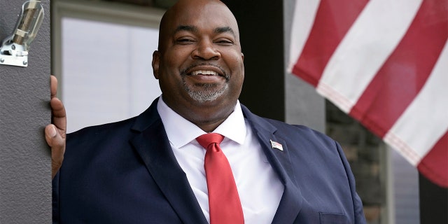 Then-North Carolina Lt. Gov-elect Mark Robinson is shown at his home in Colfax, N.C., Tuesday, Nov. 10, 2020. Robinson is North Carolina's first Black lieutenant governor. He hopes he can work with Democratic Gov. Roy Cooper and state lawmakers on veterans-related issues. (AP Photo/Gerry Broome)