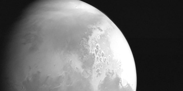 In this undated photo released by the China National Space Administration, a view of the planet Mars is captured by China's Tianwen-1 Mars probe from a distance of 2.2 million kilometers (1.37 million miles). (CNSA/Xinhua via AP)