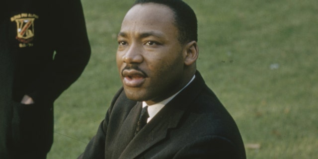 On the campus of Atlanta University (later renamed Clark Atlanta University), American religious and civil rights leader, Martin Luther King Jr., sat with his hands on his knees in mid-May 1960.  (Photo by Howard Sochurek / The LIFE Image Collection via Getty Images)