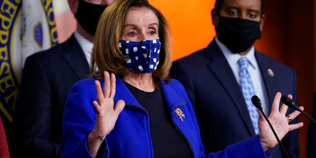 House Speaker Nancy Pelosi of Calif., with impeachment managers Rep. Eric Swalwell, D-Calif., and Rep. Joe Neguse, D-Colo., speaks to members of the media during a news conference on Capitol Hill.