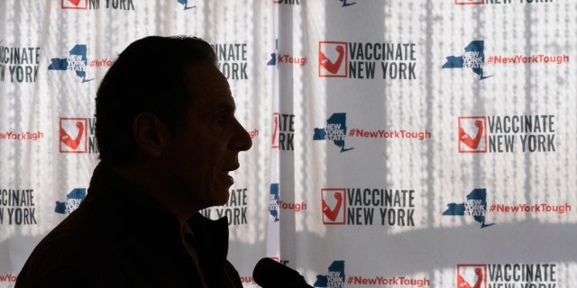 FILE - In this Saturday, Jan. 23, 2021 file photo, Gov. Andrew Cuomo speaks to reporters during a news conference at a COVID-19 pop-up vaccination site in the William Reid Apartments in the Brooklyn borough of New York. More than 9,000 recovering coronavirus patients in New York state were released from hospitals into nursing homes at the height of the pandemic under a controversial order that was scrapped amid criticisms it accelerated outbreaks, according to new records obtained by The Associated Press. (AP Photo/Mary Altaffer, Pool)