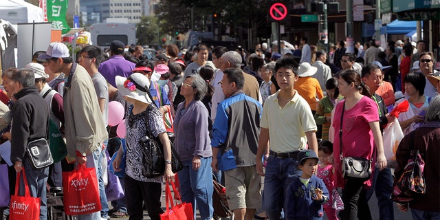 Thousands pack Franklin, Eighth and the surrounding streets to attend the 27th annual Chinatown StreetFest in Oakland, Calif. on Saturday, Aug. 23, 2014. 