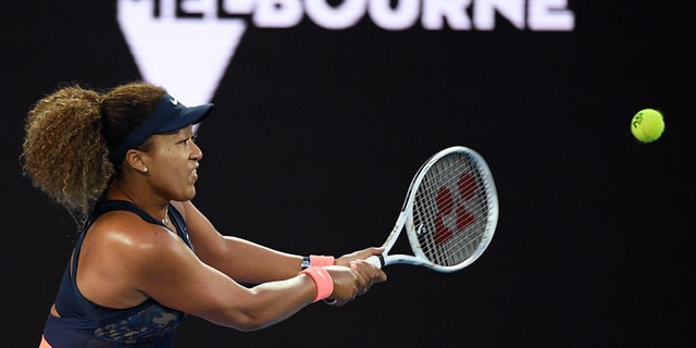 Japan's Naomi Osaka hits a backhand return to United States' Jennifer Brady during the women's singles final at the Australian Open tennis championship in Melbourne, Australia, Saturday, Feb. 20, 2021.(Associated Press)