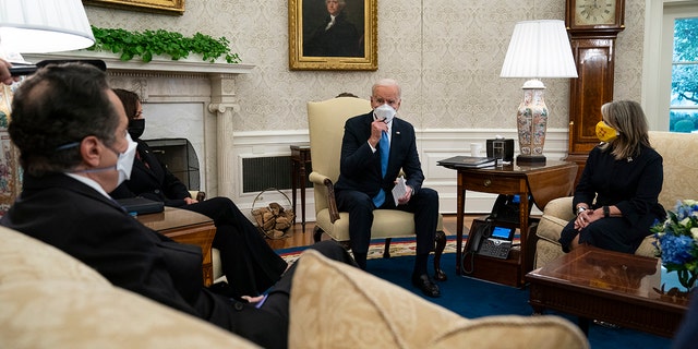 President Joe Biden speaks during a meeting with a bipartisan group of mayors and governors to discuss a coronavirus relief package, in the Oval Office of the White House, Friday, Feb. 12, 2021. (AP Photo/Evan Vucci)