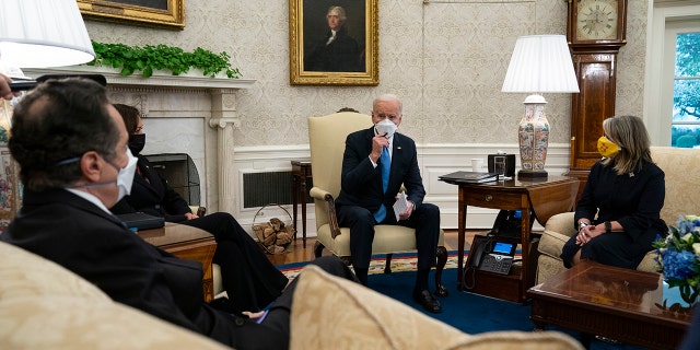 President Joe Biden speaks during a meeting with a bipartisan group of mayors and governors to discuss a coronavirus relief package, in the Oval Office of the White House, Friday, Feb. 12, 2021. (AP Photo/Evan Vucci)