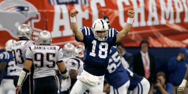 FILE - In this file photo from Jan. 21, 2007, Indianapolis Colts quarterback Peyton Manning (18) celebrates running back Joseph Addai's three-yard touchdown in the fourth quarter of the AFC Championship football game against the New England Patriots in Indianapolis.  (AP Photo / Amy Sancetta, file)