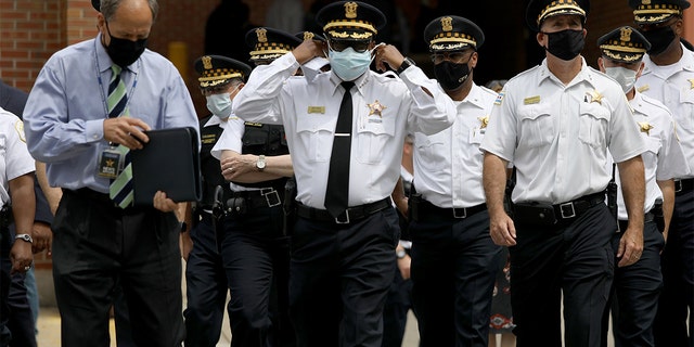 Chicago police Superintendent David Brown, center, is seen with other police leaders, July 30, 2020.