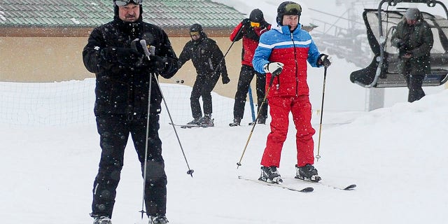 Russian President Vladimir Putin, right, and Belarusian President Alexander Lukashenko arrive at the mountain resort of Krasnaya Polyana near the Black Sea resort of Sochi, Russia, Monday, Feb. 22, 2021. (Alexei Druzhinin, Sputnik, Kremlin Pool Photo via AP)