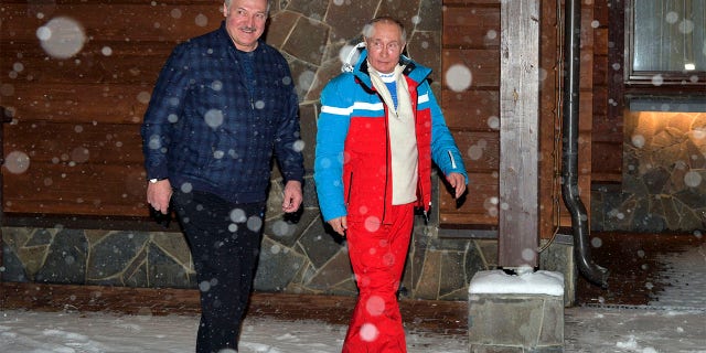 Russian President Vladimir Putin, right, and Belarusian President Alexander Lukashenko walk during their meeting at the Black Sea resort of Sochi, Russia, Monday, Feb. 22, 2021. Putin hosted his Belarusian counterpart Alexander Lukashenko for talks on Monday, amid media reports suggesting that the leader of Belarus was coming to Russia to secure one more loan. (Alexei Druzhinin, Sputnik, Kremlin Pool Photo via AP)