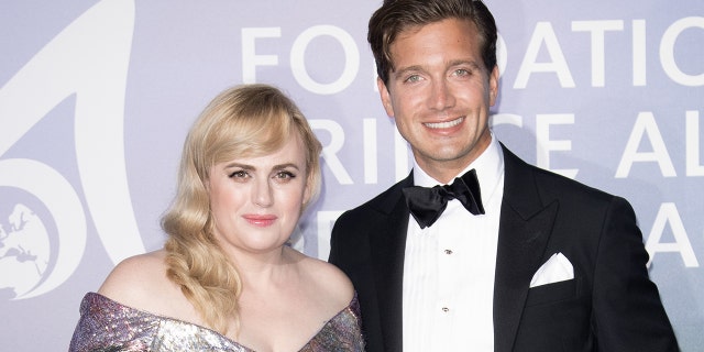 Rebel Wilson (left) and Jacob Busch (right) have reportedly split after several months of dating.  (Photo by SC Pool - Corbis / Corbis via Getty Images)