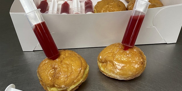 For a limited time, the sweet shop sold boxes of half a dozen glazed doughnuts packed with syringes full of raspberry jelly, to playfully "immunize" the treats at home.