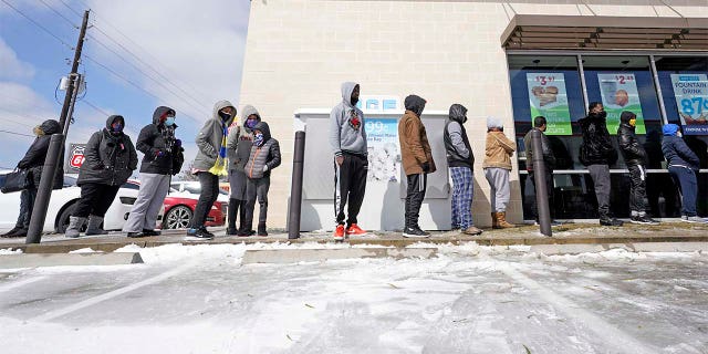 People line up to shop on Monday, February 15, 2021 in Houston.