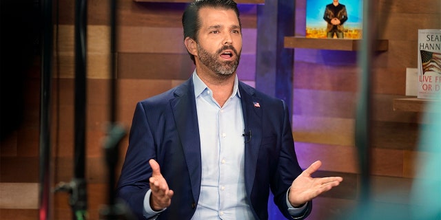 Donald Trump Jr. does an interview on media row at the Conservative Political Action Conference (CPAC) Friday, Feb. 26, 2021, in Orlando, Fla. (AP Photo/John Raoux)