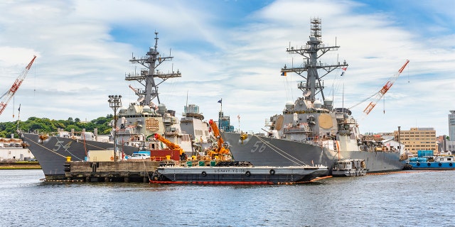 American Arleigh Burke-class destroyer USS John S. McCain DDG-56 and USS Curtis Wilbur DDG-54 of the United States Navy berthed in the Japanese Yokosuka naval base.