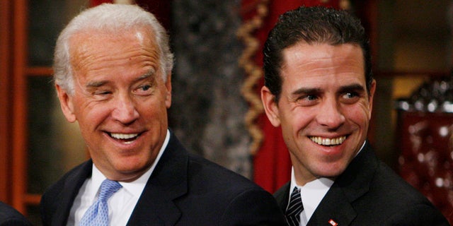 Vice President-elect Joe Biden stands with son Hunter during a reenactment of the Senate oath ceremony in the Old Senate Chamber on Capitol Hill in Washington, D.C., Jan. 6, 2009.