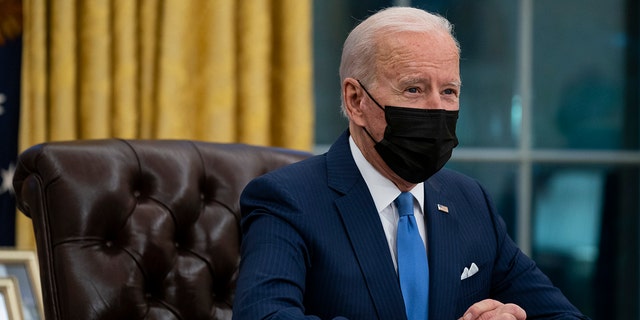 President Joe Biden delivers remarks on immigration, in the Oval Office of the White House, Tuesday, Feb. 2, 2021, in Washington. (AP Photo/Evan Vucci)
