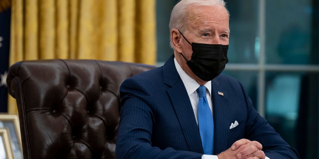 President Joe Biden delivers remarks on immigration, in the Oval Office of the White House, Tuesday, Feb. 2, 2021, in Washington. (AP Photo/Evan Vucci)
