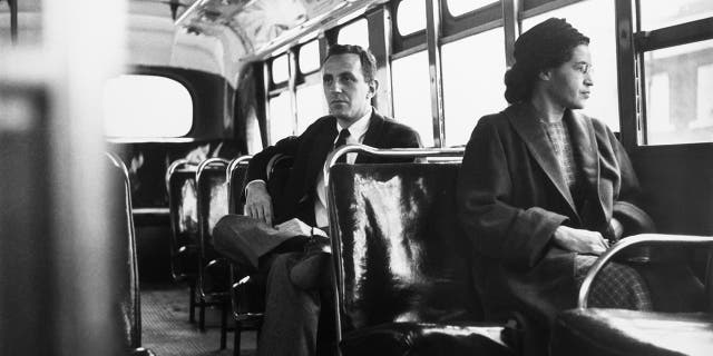 American civil rights activist Rosa Parks sits in the front of a bus in Montgomery, Alabama, after the Supreme Court ruled segregation illegal on the city bus system on Dec. 21, 1956.