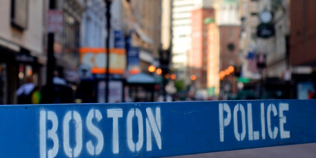 This file photo shows a police barricade at a crime scene in Boston. 