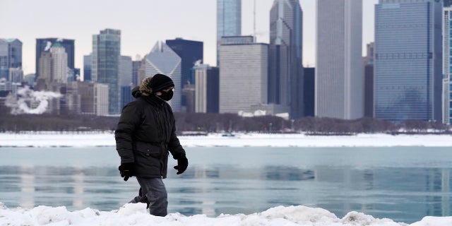 A man is bundled up against the cold in Chicago on Sunday. (AP)