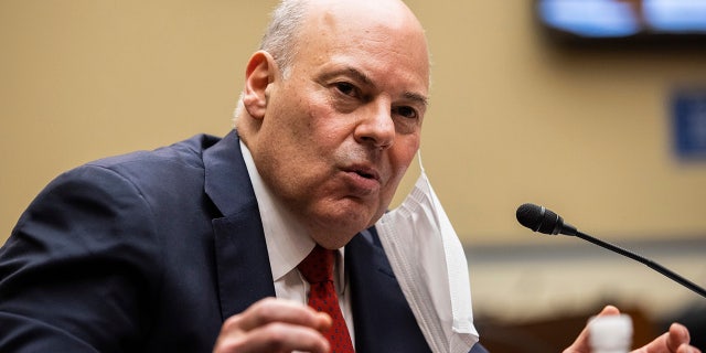United States Postal Service Postmaster General Louis DeJoy speaks during a House Oversight and Reform Committee hearing on "Legislative Proposals to Put the Postal Service on Sustainable Financial Footing" on Capitol Hill, Wednesday, Feb. 24, 2021, in Washington. (Graeme Jennings/Pool via AP)