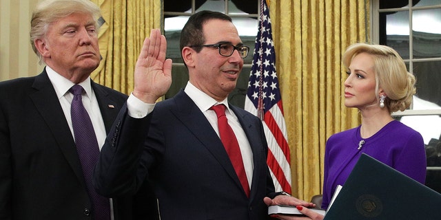 Louise Linton supports then-fiance Steven Mnuchin at his swearing-in ceremony with former President Donald Trump.