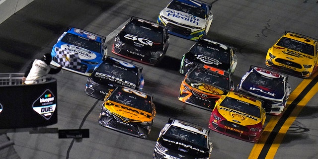 Aric Almirola (10) defeats Christopher Bell (20), Ryan Newman (6) and Joey Logano (22) to the finish line to win the first qualifying car race of the NASCAR Daytona 500 duel.