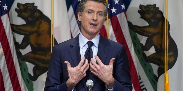 FILE - In this Jan. 8, 2021, file photo, California Gov. Gavin Newsom outlines his 2021-2022 state budget proposal during a news conference in Sacramento, Calif. About a year after the state's first coronavirus case, Newsom has gone from a governor widely hailed for his swift response to a leader facing criticism from all angles. (AP Photo/Rich Pedroncelli, Pool, File)