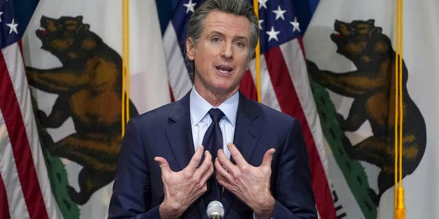 FILE - In this Jan. 8, 2021, file photo, California Gov. Gavin Newsom outlines his 2021-2022 state budget proposal during a news conference in Sacramento, Calif. About a year after the state's first coronavirus case, Newsom has gone from a governor widely hailed for his swift response to a leader facing criticism from all angles. (AP Photo/Rich Pedroncelli, Pool, File)