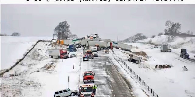 This image provided the Iowa Transportation Department from a traffic camera shows a massive pileup on Interstate 80 on Thursday, west of Newton. The eastbound lanes of the interstate were closed following the chain-reaction crash, which involved roughly 40 vehicles. (AP/Iowa Transportation Department)