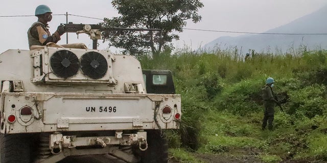 United Nations peacekeepers guard the area where a U.N. convoy was attacked and the Italian ambassador to Congo killed. (AP Photo/Justin Kabumba)
