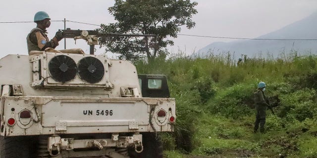 United Nations peacekeepers guard the area where a U.N. convoy was attacked and the Italian ambassador to Congo killed. (AP Photo/Justin Kabumba)