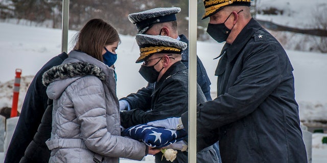 Three flags were presented: one to the mother, one to the father and one to the fiancée, Zion Perry.