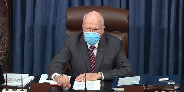 In this image from video, Sen. Patrick Leahy, D-Vt., the president pro tempore of the Senate, who is presiding over the second impeachment trial of former President Donald Trump, opens the trial day in the Senate at the U.S. Capitol in Washington, Tuesday, Feb. 9, 2021. (Senate Television via AP)