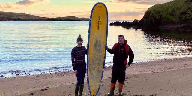 Stephanie Riise, 22, and Jake Anderson, 23, found this 9-foot surfboard while they were on a walk on Dec. 28.
