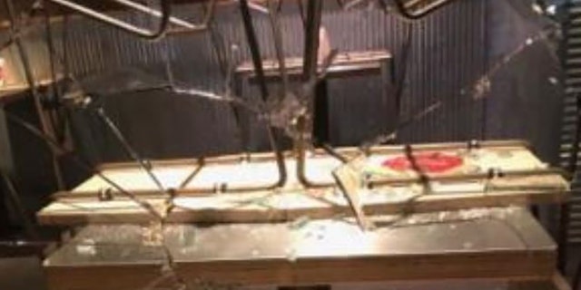 Rioters smashed the window of a restaurant in downtown Portland during a night of destruction Saturday. 