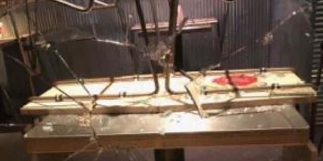 Rioters smashed the window of a restaurant in downtown Portland during a night of destruction Saturday.