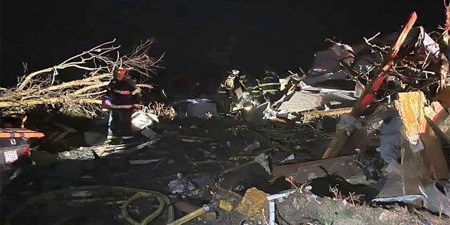 Firefighters respond to a site after a deadly tornado tore through Brunswick County, N.C., on Tuesday. (AP/Brunswick County Sheriff’s Office)