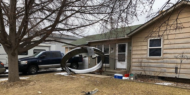 Debris from a Boeing 777 commercial plane touched down outside a house near Broomfield, about 20 miles north of downtown Denver, after the engine malfunctioned shortly after takeoff.