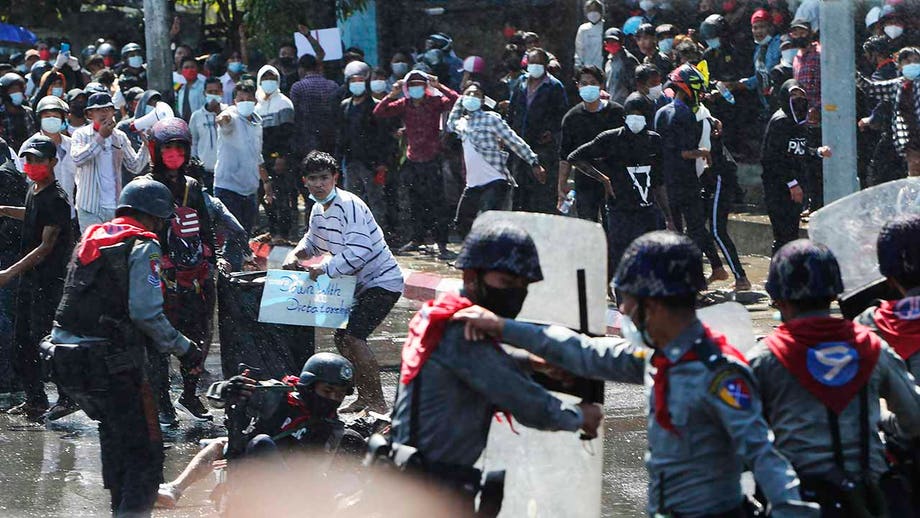 Police in Burma crack down on crowds defying protest ban