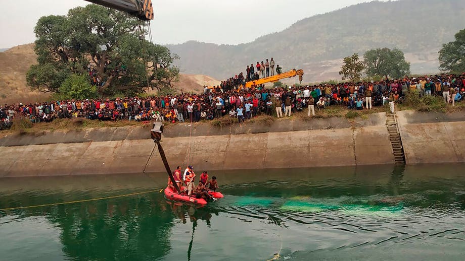 Bus drives off bridge into canal in central India; 40 dead