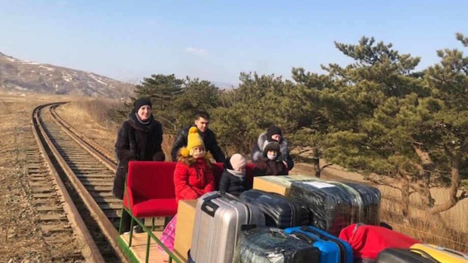 Russian diplomats exit North Korea by hand-pushed trolley