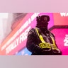 A security guard walks through Times Square during a snowstorm, Monday, Feb. 1, 2021, in the Manhattan borough of New York. (AP Photo/John Minchillo)