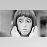 Black and white photo of Shelley Duvall in '3 Women' holding her hands to her hair