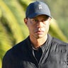 PACIFIC PALISADES, CA : Tiger Woods looks on from the 18th hole during the final round of The Genesis Invitational golf tournament at the Riviera Country Club in Pacific Palisades, CA on February 21, 2021. (Photo by Brian Rothmuller/Icon Sportswire via Getty Images)