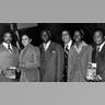 A half-length portrait of a group of men and women holding copies of "Paul Robeson, The Great Forerunner" by the editors of Freedomways, 1980. (Photo by Afro American Newspapers/Gado/Getty Images)