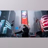 Patricia Burgara from Mexico, who is in New York City to celebrate her birthday, takes a selfie in Times Square during a snowstorm, Monday, Feb. 1, 2021, in New York. (AP Photo/Wong Maye-E)