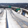 Traffic moves along Interstate 30 after a snow storm Feb. 15, 2021, in Fort Worth, Texas. Winter storm Uri has brought historic cold weather to Texas and storms have swept across 26 states with a mix of freezing temperatures and precipitation.